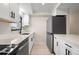 Modern kitchen with white cabinets and quartz countertops at 1439 Mediterranean Dr # C, Punta Gorda, FL 33950