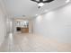 Open living room with kitchen view and shiplap wall at 1439 Mediterranean Dr # C, Punta Gorda, FL 33950