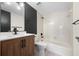 Updated bathroom with wood vanity and bathtub at 1439 Mediterranean Dr # C, Punta Gorda, FL 33950