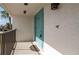 Inviting teal front door entrance with a balcony at 1439 Mediterranean Dr # C, Punta Gorda, FL 33950