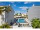 Community pool with surrounding patio furniture at 1439 Mediterranean Dr # C, Punta Gorda, FL 33950