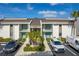 Two-story building exterior with parking and landscaping at 1439 Mediterranean Dr # C, Punta Gorda, FL 33950