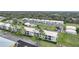 Aerial view of condo community showing building, pool, and surrounding area at 26485 Rampart Blvd # D28, Punta Gorda, FL 33983