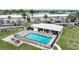 Community pool with lounge chairs and tables at 26485 Rampart Blvd # D28, Punta Gorda, FL 33983