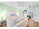 Bedroom with a queen-size bed and mirrored closet doors at 26485 Rampart Blvd # D28, Punta Gorda, FL 33983