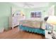 Bright bedroom with a queen-size bed and white dresser at 26485 Rampart Blvd # D28, Punta Gorda, FL 33983