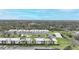 Aerial view of condo community showing building, pool, and surrounding area at 26485 Rampart Blvd # D28, Punta Gorda, FL 33983