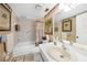 Bathroom with shower/tub combo and updated vanity at 26485 Rampart Blvd # D28, Punta Gorda, FL 33983