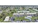 Aerial view of a condo community with a pool and ample parking at 26485 Rampart Blvd # D28, Punta Gorda, FL 33983