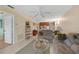 Living room with couch, coffee table, and view of the kitchen at 26485 Rampart Blvd # D28, Punta Gorda, FL 33983