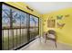 Sunroom with sliding glass doors and view of patio at 26485 Rampart Blvd # D28, Punta Gorda, FL 33983