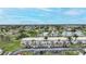 Aerial view of condo building with parking lot and surrounding area at 26485 Rampart Blvd # D28, Punta Gorda, FL 33983