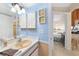 Clean bathroom with single sink and view of bedroom at 26485 Rampart Blvd # D28, Punta Gorda, FL 33983