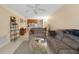 Living room with couch, coffee table, and view of the kitchen at 26485 Rampart Blvd # D28, Punta Gorda, FL 33983