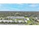 Aerial view of condo community showing building, pool, and surrounding area at 26485 Rampart Blvd # D28, Punta Gorda, FL 33983
