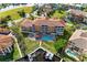 Aerial view of a beautiful waterfront building with boat docks, a pool and lush landscaping at 3322 Purple Martin Dr # 135, Punta Gorda, FL 33950