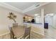 Dining area adjacent to kitchen with seating for four and wood-look flooring at 3322 Purple Martin Dr # 135, Punta Gorda, FL 33950
