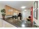 Kitchen with breakfast bar, warm cabinets, and modern appliances at 3322 Purple Martin Dr # 135, Punta Gorda, FL 33950