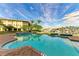 Community pool with patio furniture and water views at 3322 Purple Martin Dr # 135, Punta Gorda, FL 33950