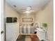 Small bedroom with full bed and ceiling fan at 3322 Purple Martin Dr # 135, Punta Gorda, FL 33950