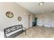 Building entrance with tiled floor, bench, and access to multiple doors at 3322 Purple Martin Dr # 135, Punta Gorda, FL 33950