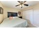 King bedroom with ceiling fan and double doors to closet at 3322 Purple Martin Dr # 135, Punta Gorda, FL 33950
