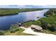 Scenic waterfront property with private dock and lush vegetation at 28968 Gin Ln, Punta Gorda, FL 33982