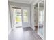 Bright and airy entryway with wood-look tile floors at 28968 Gin Ln, Punta Gorda, FL 33982