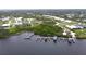 Bird's-eye view of waterfront community with several houses and docks at 28968 Gin Ln, Punta Gorda, FL 33982