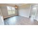 Bright dining room with hardwood floors and large window at 28968 Gin Ln, Punta Gorda, FL 33982