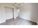 Bright bedroom with wood-look floors and spacious closet at 28968 Gin Ln, Punta Gorda, FL 33982