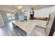 Spacious kitchen with granite island and white cabinetry at 28968 Gin Ln, Punta Gorda, FL 33982