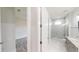 Modern bathroom with shower, vanity, and grey cabinets at 28968 Gin Ln, Punta Gorda, FL 33982
