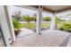 Covered porch with paver floor and view of backyard at 28968 Gin Ln, Punta Gorda, FL 33982
