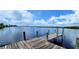 Wooden dock extending over calm water with mangrove trees at 28968 Gin Ln, Punta Gorda, FL 33982