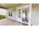 Front entry with glass door leading into home at 28968 Gin Ln, Punta Gorda, FL 33982