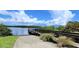 Wooden boat dock with access ramp and surrounding vegetation at 28968 Gin Ln, Punta Gorda, FL 33982
