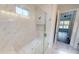 Large walk-in shower with marble tile and built-in seat at 28968 Gin Ln, Punta Gorda, FL 33982