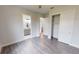 Bright bedroom with wood-look floors and en-suite bathroom at 28968 Gin Ln, Punta Gorda, FL 33982