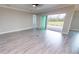 Open living room with sliding glass doors to patio at 28968 Gin Ln, Punta Gorda, FL 33982