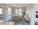 Elegant dining room featuring a chic table setting and hardwood floors at 28968 Gin Ln, Punta Gorda, FL 33982