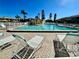 Relaxing community pool with lounge chairs for residents to enjoy in a tropical location at 9209 Seminole Blvd # 117, Seminole, FL 33772