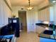 White kitchen cabinets, granite countertops, and black appliances at 98 Vivante Blvd # 98412, Punta Gorda, FL 33950