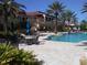 Relaxing pool area with patio tables and landscaping at 98 Vivante Blvd # 98412, Punta Gorda, FL 33950