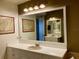 Bright bathroom with a large vanity mirror and ample counter space at 98 Vivante Blvd # 98412, Punta Gorda, FL 33950