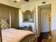 Main bedroom with a large bed, mirror, and access to the bathroom at 98 Vivante Blvd # 98412, Punta Gorda, FL 33950