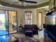 Bright living room featuring leather furniture and sliding glass doors at 98 Vivante Blvd # 98412, Punta Gorda, FL 33950
