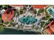 Aerial view of community pool and surrounding buildings at 98 Vivante Blvd # 98412, Punta Gorda, FL 33950