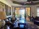 Spacious living room with leather furniture and access to a balcony at 98 Vivante Blvd # 98412, Punta Gorda, FL 33950