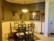 Elegant dining room with a table for six and decorative wall coverings at 98 Vivante Blvd # 98412, Punta Gorda, FL 33950